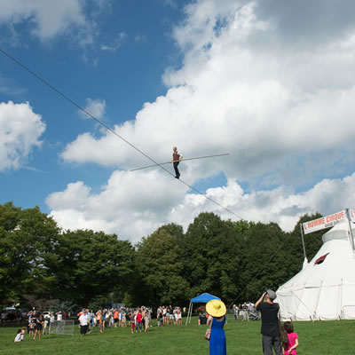 Tight rope walker performing at festival by Nesbitt Arts Consulting