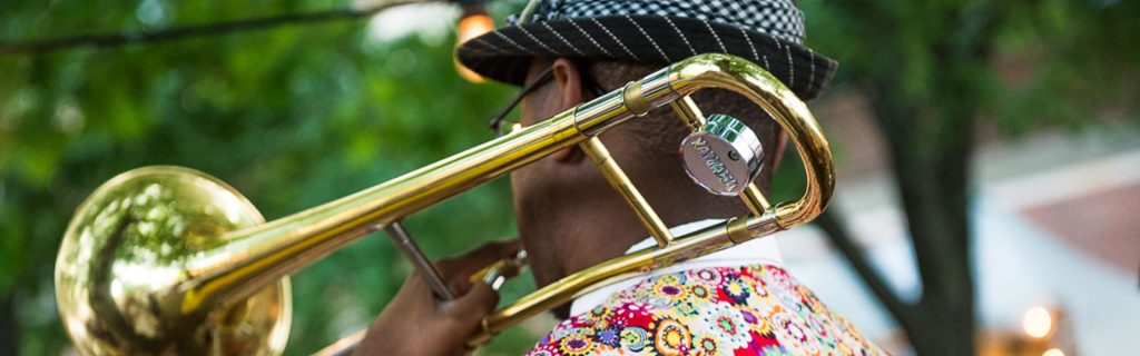 Musician playing trombone at Ann Arbor Summer Festival by Amy Nesbitt